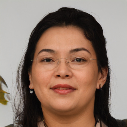 Joyful asian adult female with medium  brown hair and brown eyes