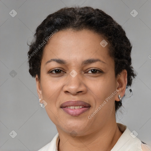 Joyful black adult female with short  brown hair and brown eyes