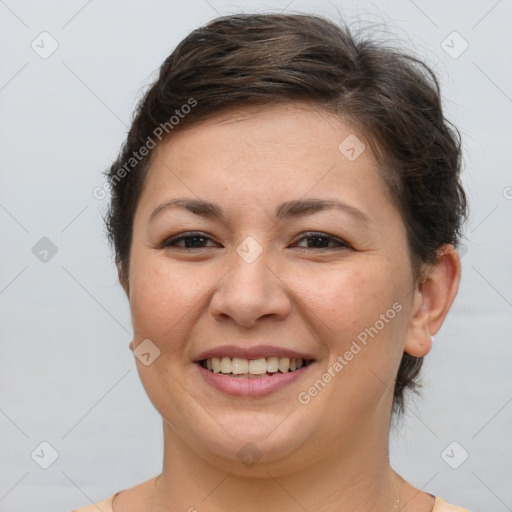 Joyful white young-adult female with short  brown hair and brown eyes