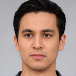Neutral white young-adult male with short  black hair and brown eyes