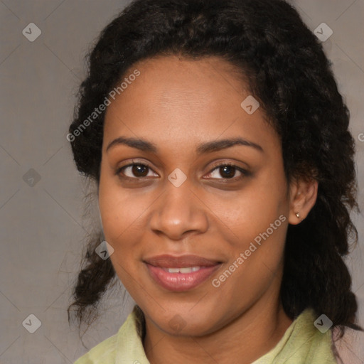 Joyful black adult female with medium  black hair and brown eyes