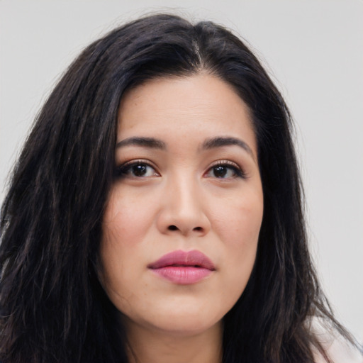Joyful asian young-adult female with long  black hair and brown eyes