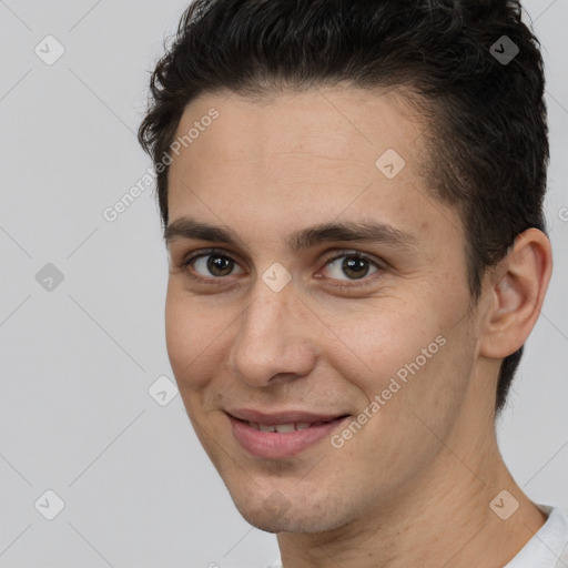 Joyful white young-adult male with short  brown hair and brown eyes