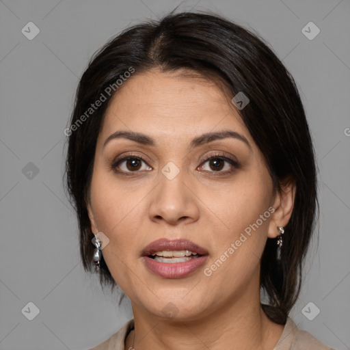 Joyful white adult female with medium  brown hair and brown eyes