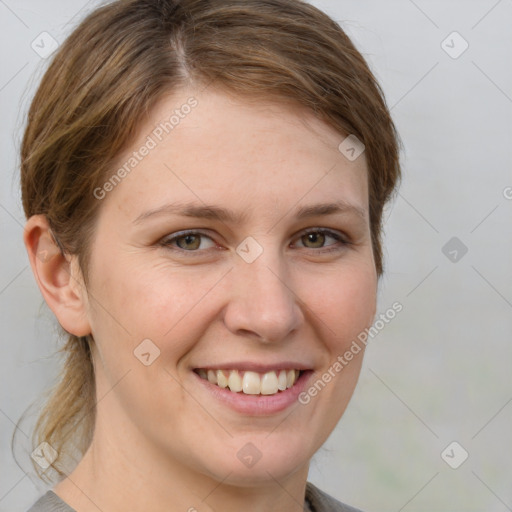 Joyful white young-adult female with medium  brown hair and grey eyes