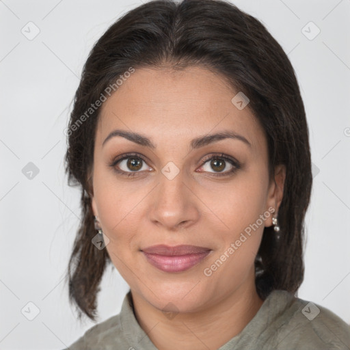 Joyful latino young-adult female with medium  brown hair and brown eyes