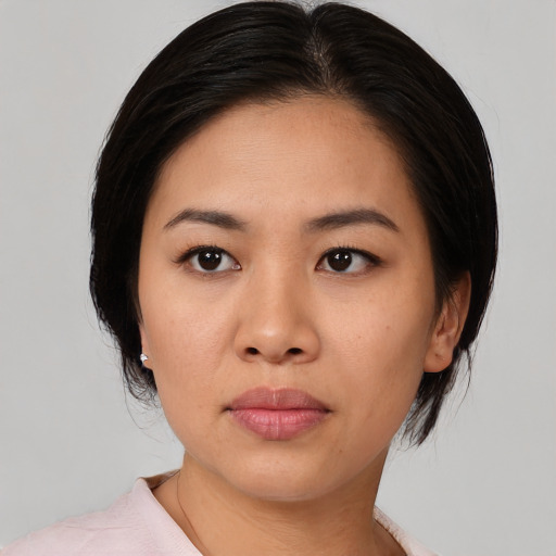 Neutral asian young-adult female with medium  black hair and brown eyes