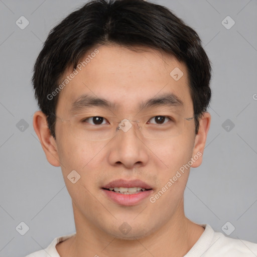 Joyful asian young-adult male with short  brown hair and brown eyes