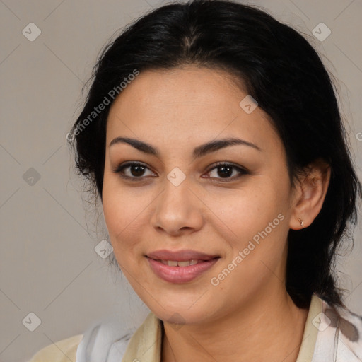 Joyful latino young-adult female with medium  brown hair and brown eyes