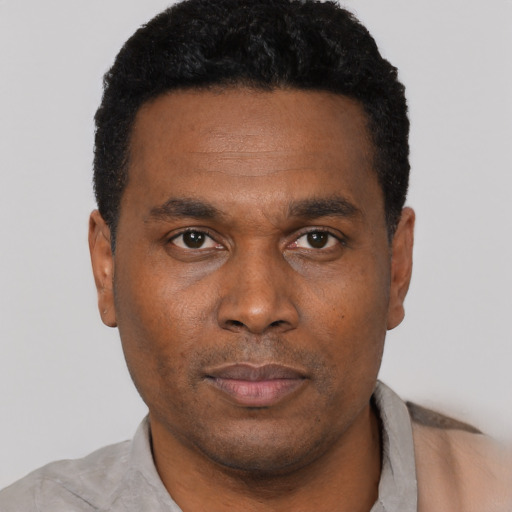 Neutral black young-adult male with short  black hair and brown eyes