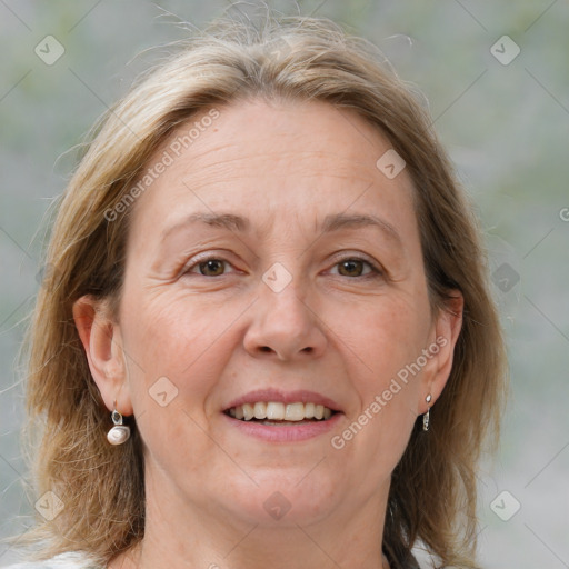 Joyful white adult female with medium  brown hair and grey eyes