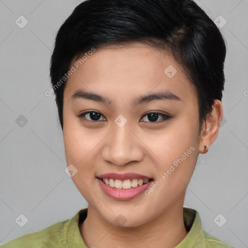 Joyful asian young-adult female with short  brown hair and brown eyes