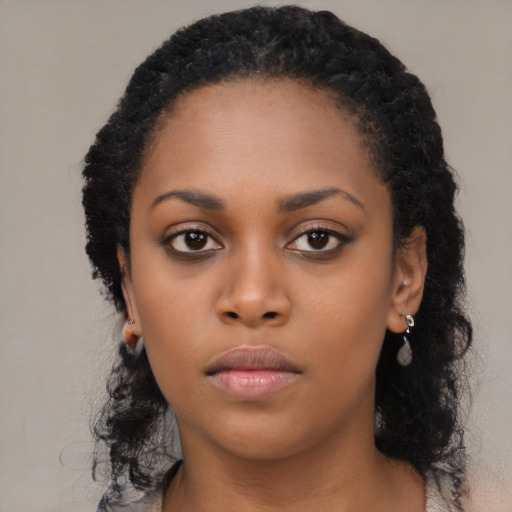 Neutral black young-adult female with long  black hair and brown eyes