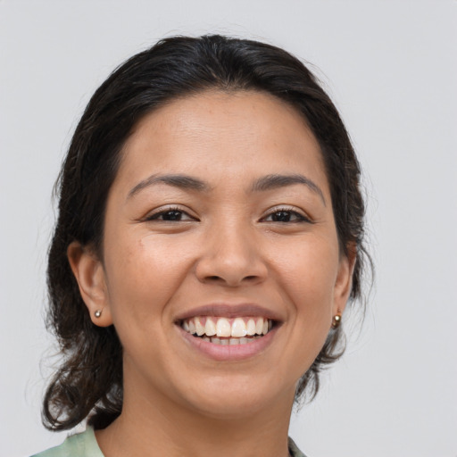 Joyful asian young-adult female with medium  brown hair and brown eyes