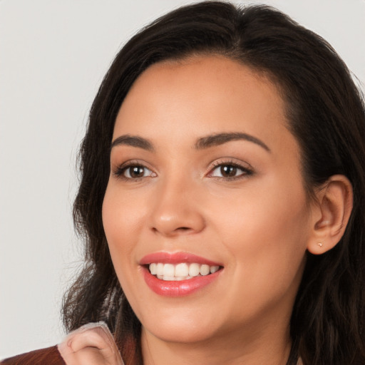 Joyful white young-adult female with medium  black hair and brown eyes