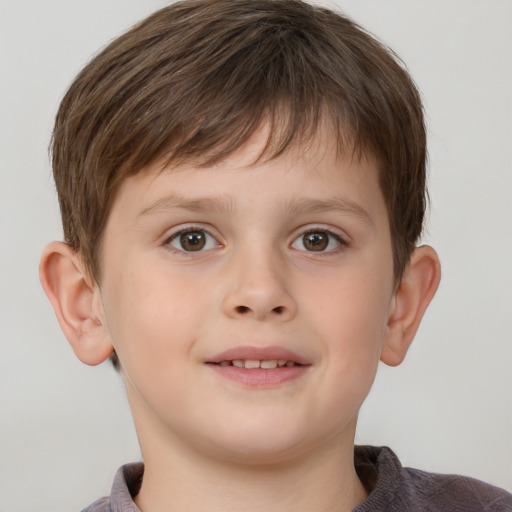 Joyful white child male with short  brown hair and brown eyes