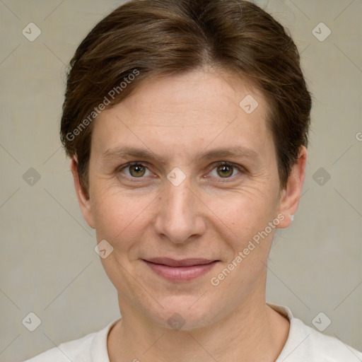 Joyful white adult female with short  brown hair and grey eyes