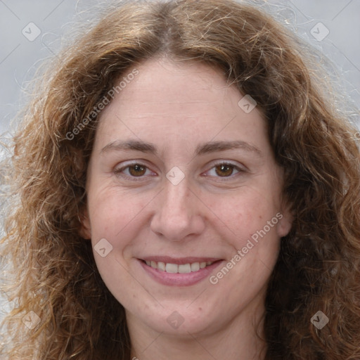 Joyful white adult female with long  brown hair and brown eyes