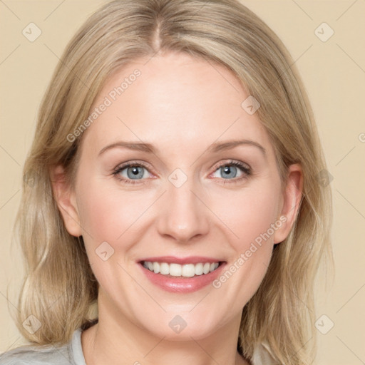 Joyful white adult female with medium  brown hair and blue eyes