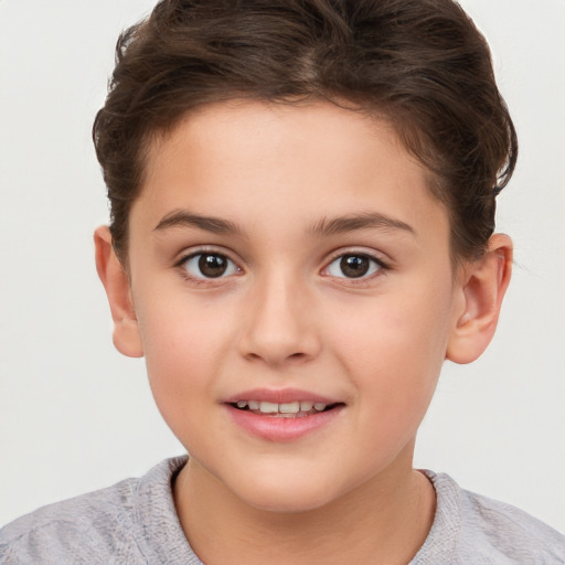 Joyful white child female with short  brown hair and brown eyes