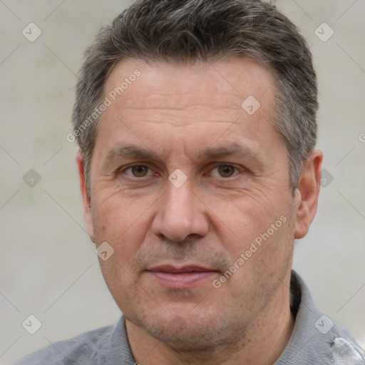 Joyful white middle-aged male with short  brown hair and brown eyes