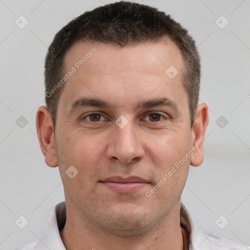 Joyful white adult male with short  brown hair and brown eyes