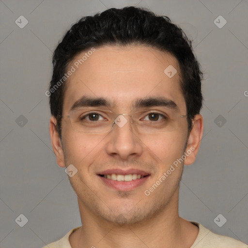 Joyful white young-adult male with short  black hair and brown eyes