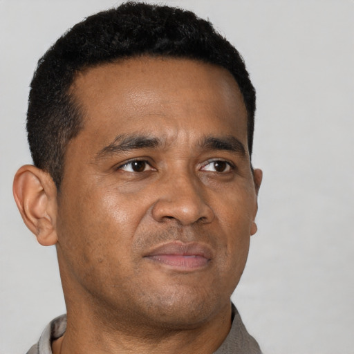 Neutral black young-adult male with short  brown hair and brown eyes