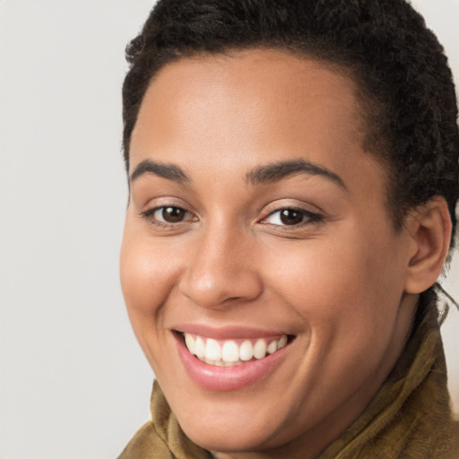 Joyful white young-adult female with short  brown hair and brown eyes