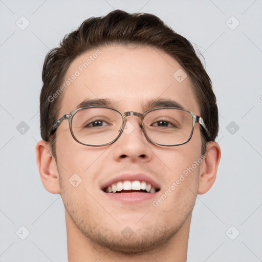 Joyful white young-adult male with short  brown hair and grey eyes