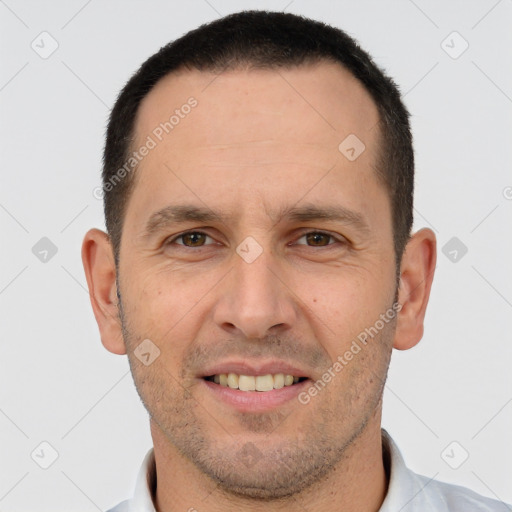 Joyful white adult male with short  brown hair and brown eyes