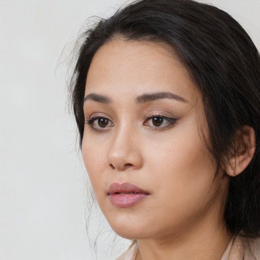 Neutral latino young-adult female with medium  black hair and brown eyes