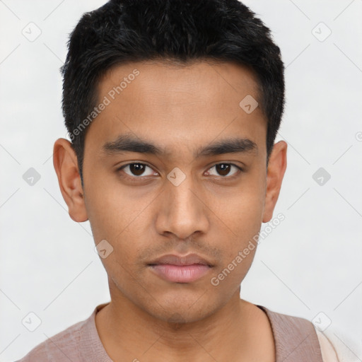 Neutral latino young-adult male with short  black hair and brown eyes