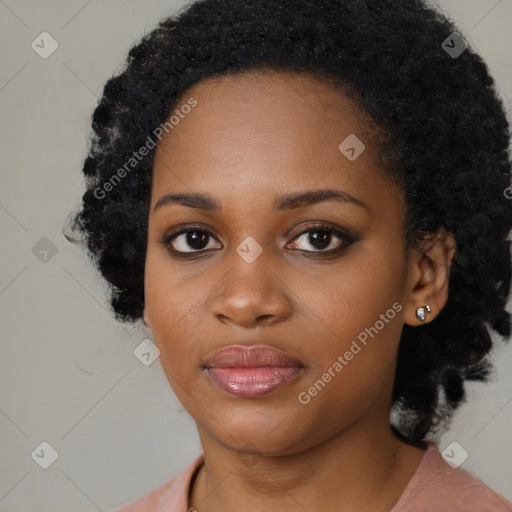 Joyful black young-adult female with medium  black hair and brown eyes