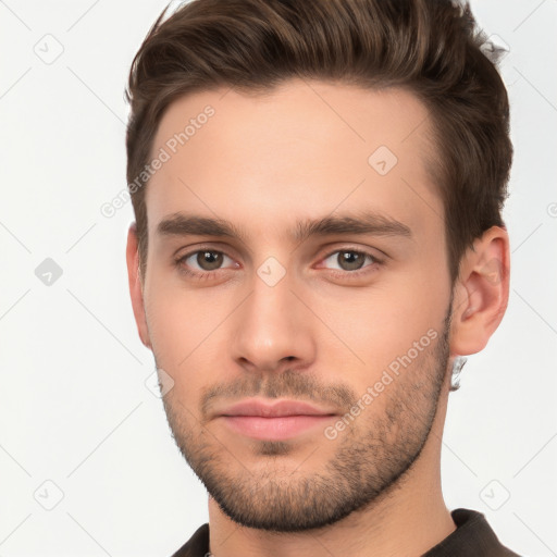 Neutral white young-adult male with short  brown hair and brown eyes