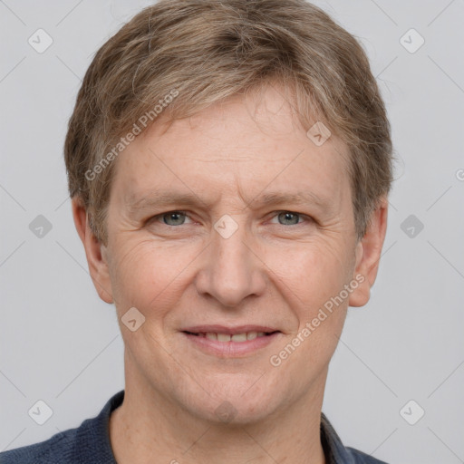 Joyful white adult male with short  brown hair and grey eyes