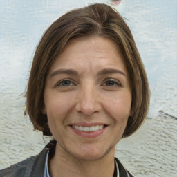 Joyful white adult female with medium  brown hair and grey eyes