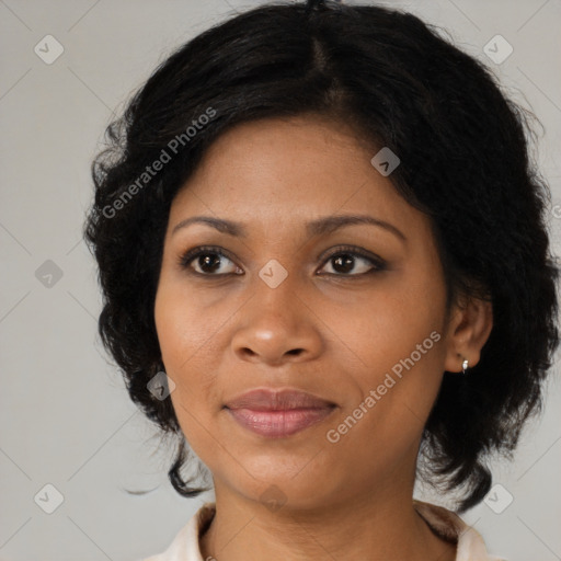 Joyful black adult female with medium  black hair and brown eyes