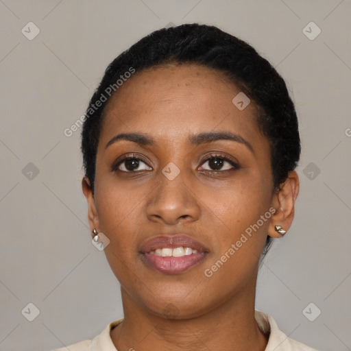 Joyful black young-adult female with short  black hair and brown eyes