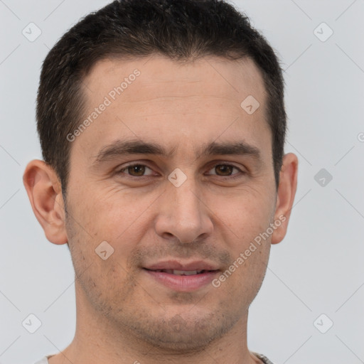 Joyful white adult male with short  brown hair and brown eyes