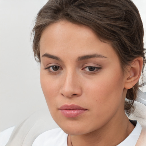 Neutral white young-adult female with short  brown hair and brown eyes