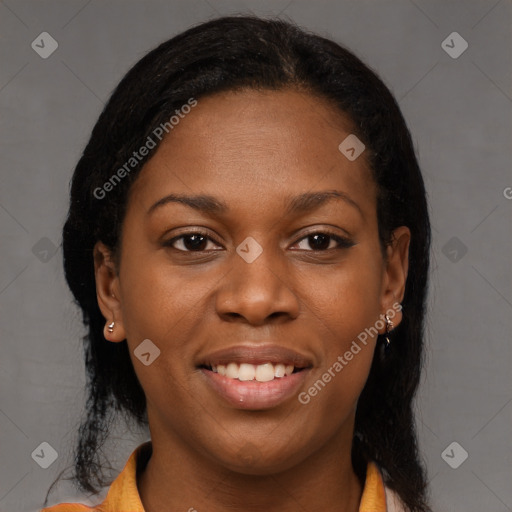 Joyful black young-adult female with long  brown hair and brown eyes