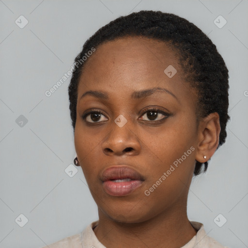 Neutral black young-adult female with short  black hair and brown eyes