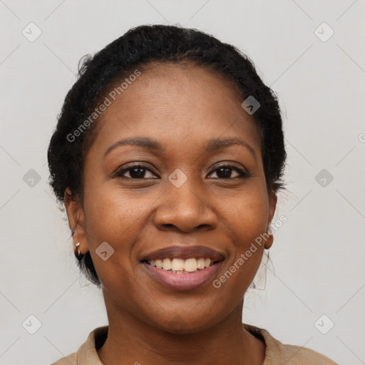 Joyful black young-adult female with short  brown hair and brown eyes