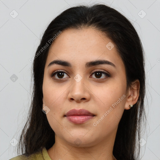 Joyful latino young-adult female with medium  brown hair and brown eyes