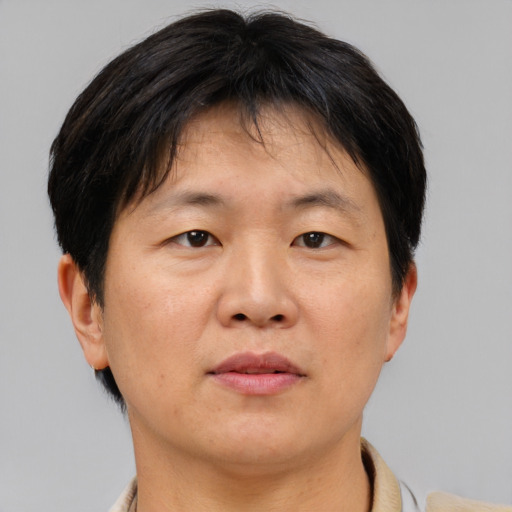 Neutral asian adult female with short  brown hair and brown eyes