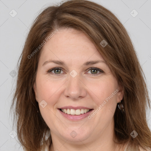 Joyful white adult female with medium  brown hair and brown eyes