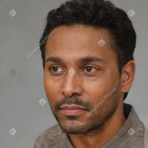 Neutral latino adult male with short  black hair and brown eyes