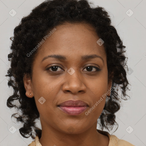 Joyful black adult female with medium  brown hair and brown eyes