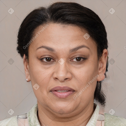 Joyful latino adult female with medium  brown hair and brown eyes